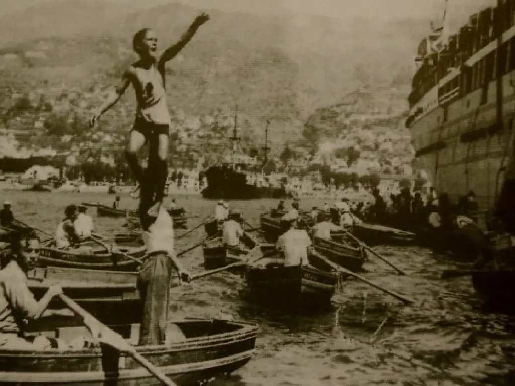 Selling rides to passengers on the to ships moored on the breakwater