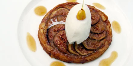Fresh fig tart with cottage cheese sorbet perfumed with lavender flambeed in Madeira wine