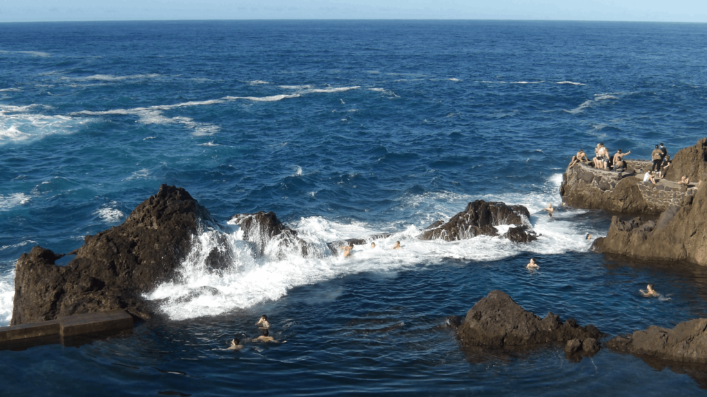 Swimmers in Porto Moniz rock pools